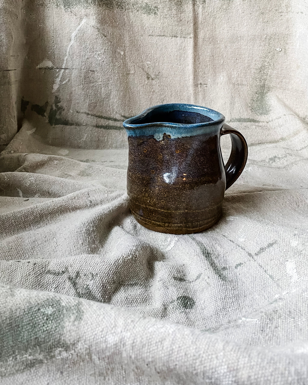 Brown and Blue Ceramic Pitcher