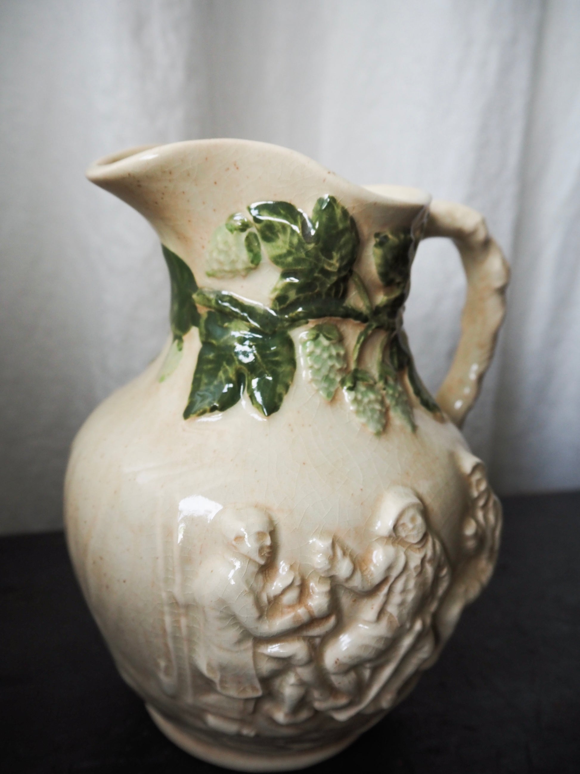 Vintage High-Relief Ceramic Pitcher with Figures and Hop Vines