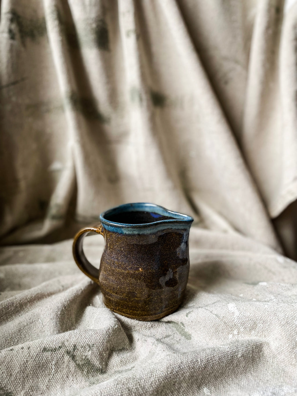 Brown and Blue Ceramic Pitcher