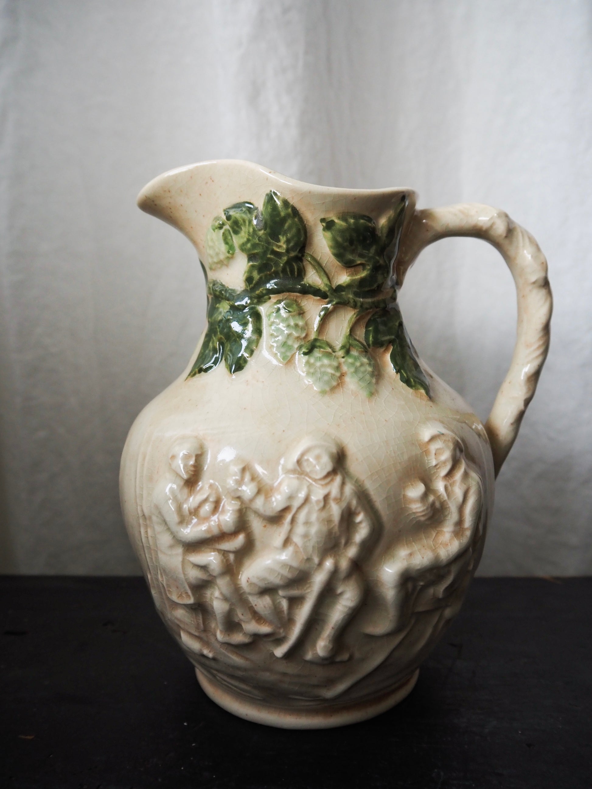 Vintage High-Relief Ceramic Pitcher with Figures and Hop Vines